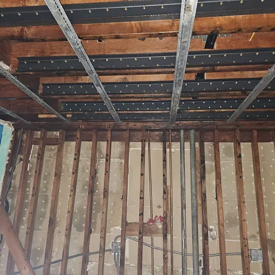 Ceiling opened to the joists inside containment, Central LA