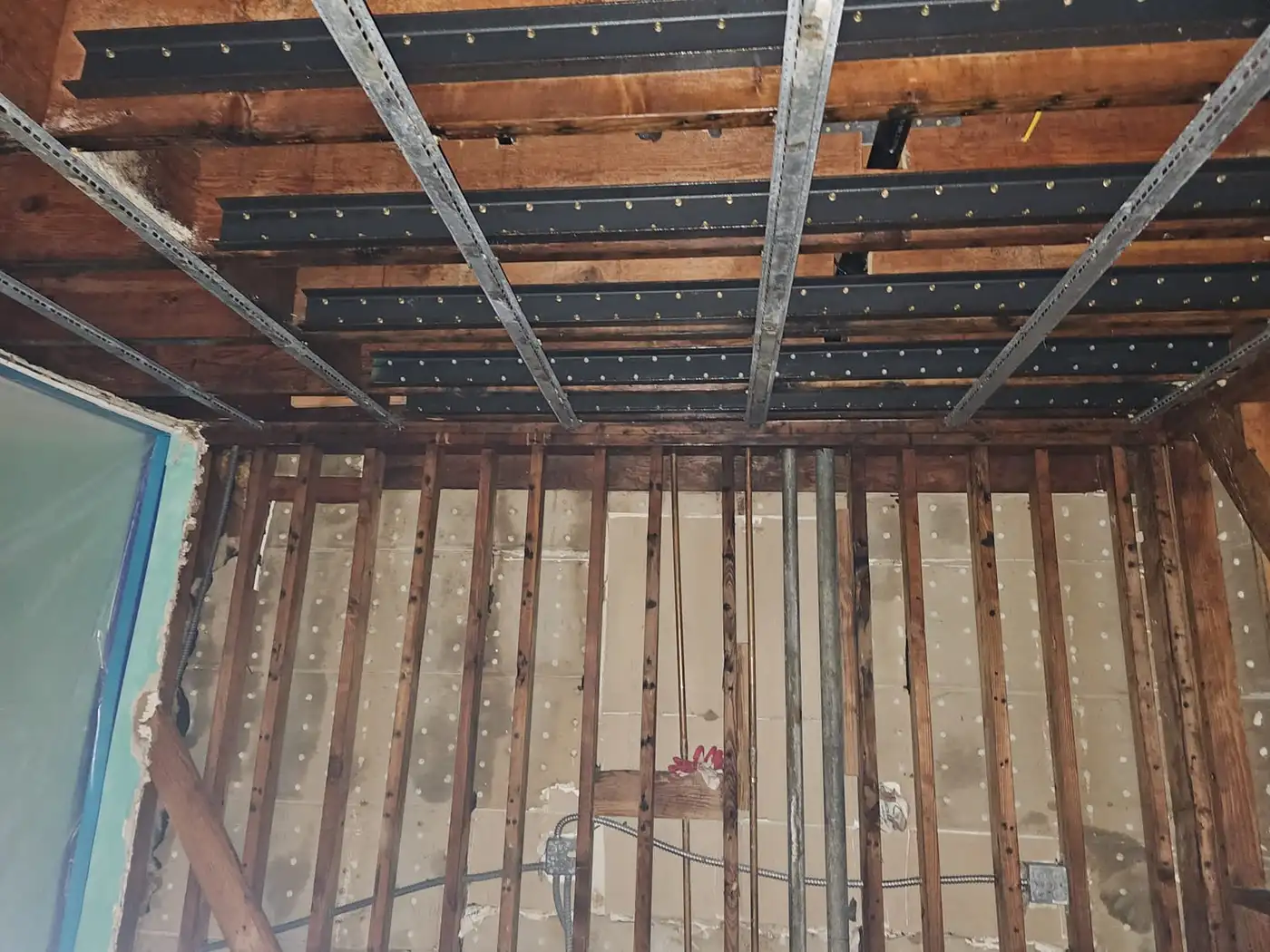 Ceiling opened to the joists inside mold containment