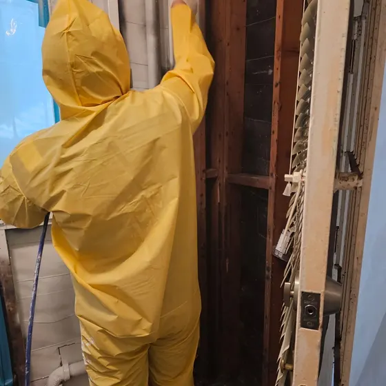 Cleaning exposed wall framing, Central LA