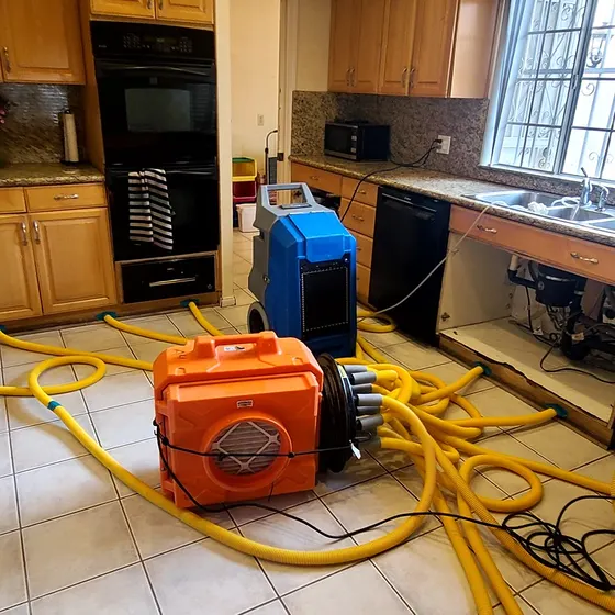 Kitchen drying setup after a sink leak, Central LA