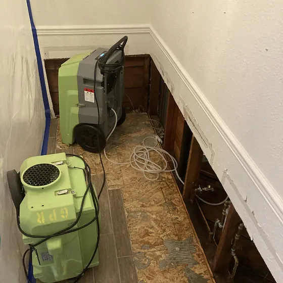 Dehumidifiers along a wall with flood cuts, Greater Seattle