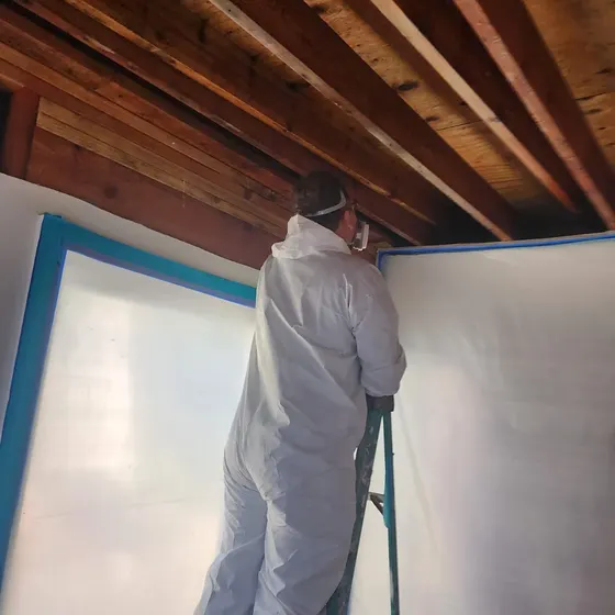 Technician working on an opened ceiling, San Gabriel Valley