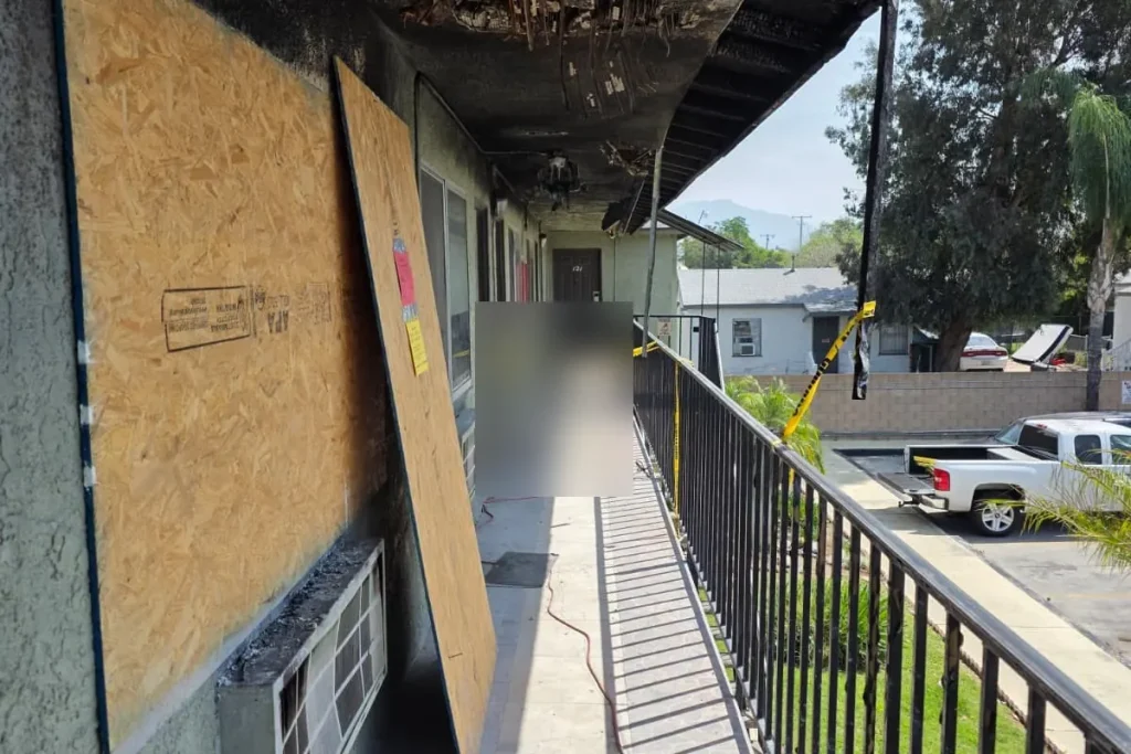 Boarded windows on a fire-damaged building