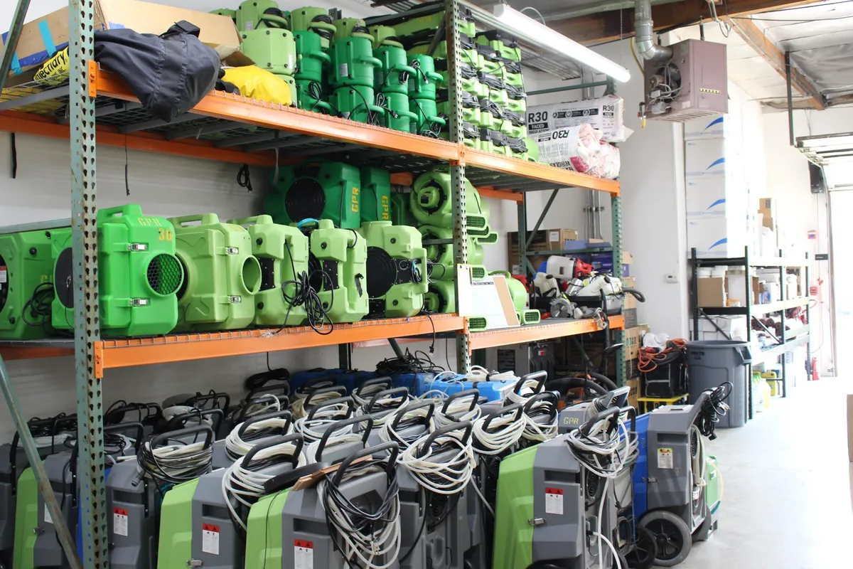 Green Planet Restoration equipment room with air movers, dehumidifiers and air scrubbers